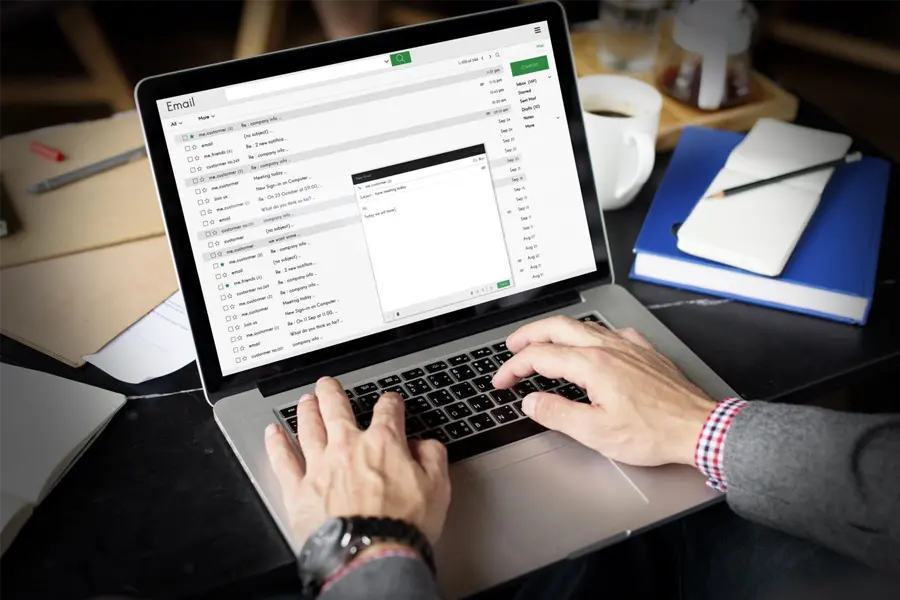 Business owner checking an email inbox on a laptop, reviewing sender authentication and deliverability