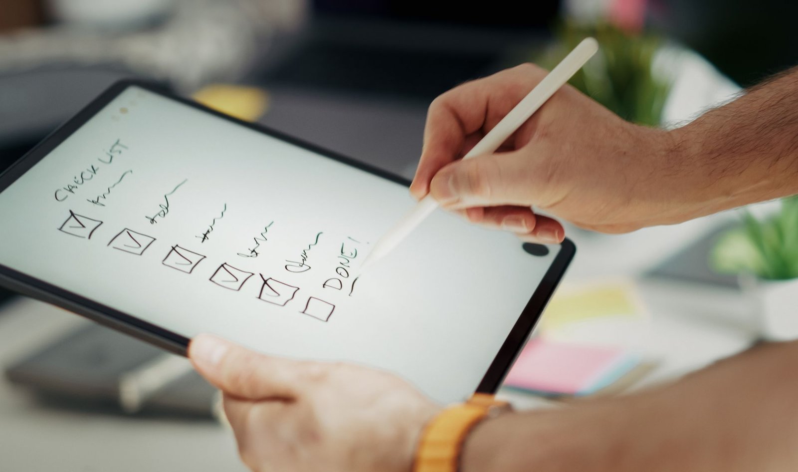 Business owner checking off a digital services checklist on a tablet, representing adding predefined services to a Google Business Profile