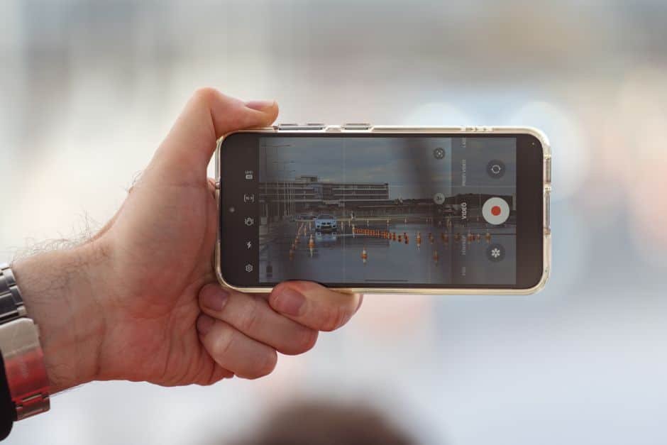 GBP video verification: business owner recording a walkthrough video on a smartphone