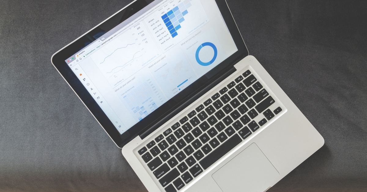 Laptop displaying a website performance score dashboard with Core Web Vitals speed metrics