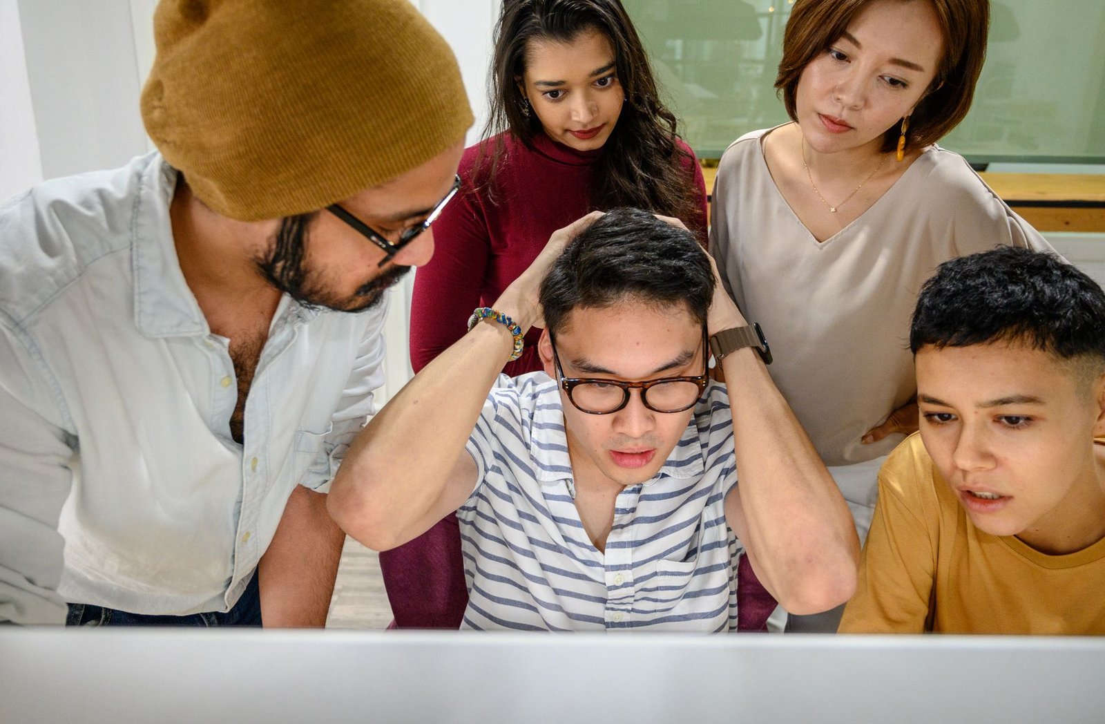 Business owners reviewing a concerning issue on screen, similar to discovering a Google Business Profile suspension