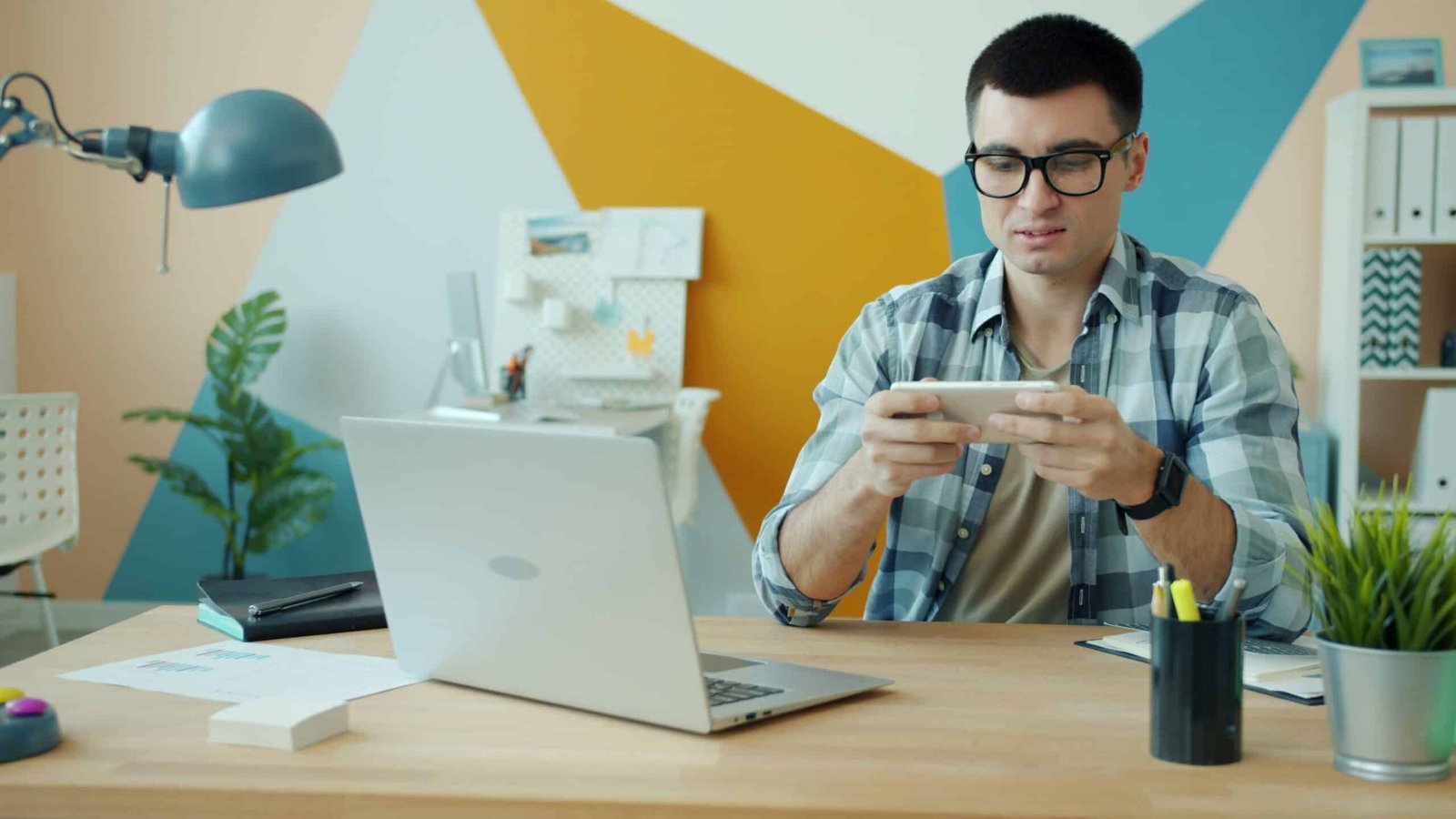 Business owner testing his AI website builder site on a smartphone before launch